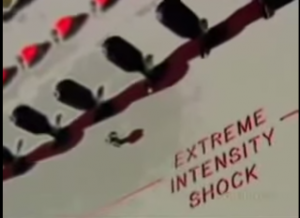 the infamous Milgram experiment shock box, with switches and in red letters EXTREME INTENSITY SHOCK
